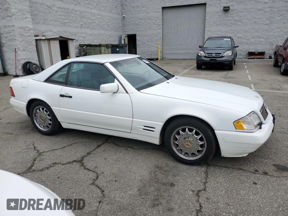 1997 Mercedes-Benz SL 500 with VIN WDBFA63F5VF143197, listed as a Copart auction lot 45003735 with 100,252 mi miles and Salvage title. Bid and sale history available at DreamBid. Image 4.
