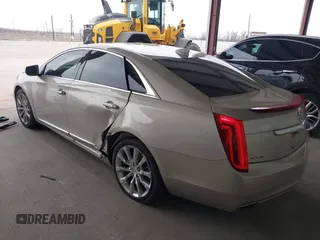 2015 Cadillac XTS Luxury z VIN 2G61M5S39F9246298, wystawiony jako IAAI lot #41555093 z przebiegiem 126 928 mil mil oraz . Historia ofert i sprzedaży dostępna na DreamBid. Obrazek 3.