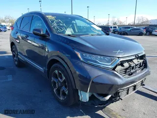 2019 Honda CR-V Touring with VIN 7FARW1H92KE014019, listed as a IAAI auction lot 41691555 with 32,635 mi miles. Bid and sale history available at carsss.com. Image 1.