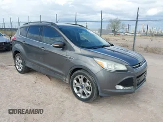 2013 Ford Escape SEL z VIN 1FMCU9H92DUB31689, wystawiony jako IAAI lot #42793573 z przebiegiem 77 824 mil mil oraz . Historia ofert i sprzedaży dostępna na DreamBid. Obrazek 1.