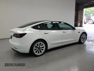 2023 Tesla Model 3 with VIN 5YJ3E1EA7PF428472, listed as a Copart auction lot 56520465 with 79,936 mi miles and Clean title. Bid and sale history available at DreamBid. Image 3.
