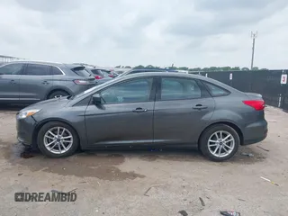 2018 Ford Focus SE z VIN 1FADP3F23JL321768, wystawiony jako IAAI lot #42415788 z przebiegiem 124 126 mil mil oraz . Historia ofert i sprzedaży dostępna na DreamBid. Obrazek 14.