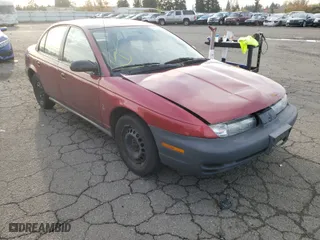 1999 Saturn SL with VIN 1G8ZH5286XZ192072, listed as a Copart auction lot 80973254 with 254,855 mi miles and Salvage Title. Bid and sale history available at carsss.com. Image 1.