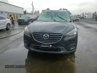 2016 Mazda CX-5 Grand Touring with VIN JM3KE4DYXG0711367, listed as a Copart auction lot 52862405 with 87,870 mi miles and Salvage Title. Bid and sale history available at DreamBid. Image 13.