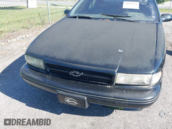 1996 Chevrolet Caprice 1SA Special Value z VIN 1G1BL52PXTR141223, wystawiony jako IAAI lot #41693524 z przebiegiem Nie podano mil oraz . Historia ofert i sprzedaży dostępna na DreamBid. Obrazek 6.