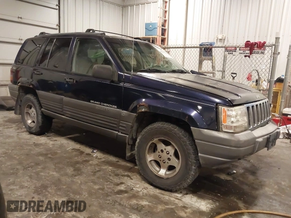 1997 Jeep Grand Cherokee Laredo with VIN 1J4GZ58S8VC675487, listed as a IAAI auction lot 41034046 with 243,284 mi miles. Bid and sale history available at carsss.com. Image 1.