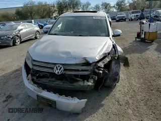 2013 Volkswagen Tiguan S with VIN WVGAV3AX8DW559779, listed as a Copart auction lot 87512845 with 79,169 mi miles and Salvage title. Bid and sale history available at DreamBid. Image 11.