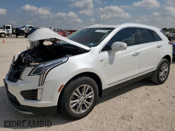 2023 Cadillac XT5 FWD Premium Luxury with VIN 1GYKNCRS7PZ150378, listed as a Copart auction lot 71792184 with 21,631 mi miles and Salvage Title. Bid and sale history available at carsss.com. Image 1.