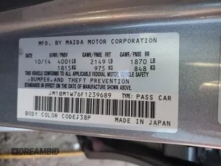 2015 Mazda 3 i Grand Touring z VIN JM1BM1W76F1239689, wystawiony jako Copart lot #55343985 z przebiegiem 14 789 mil mil oraz Szkoda całkowita • Salvage title. Historia ofert i sprzedaży dostępna na DreamBid. Obrazek 12.