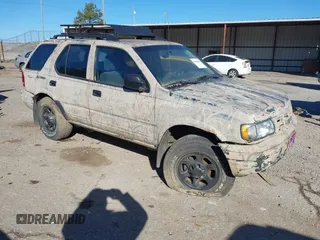 2001 Isuzu Rodeo S with VIN 4S2DM58W214322178, listed as a IAAI auction lot 41398609 with 180,017 mi miles. Bid and sale history available at carsss.com. Image 1.