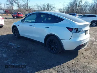 2022 Tesla Model Y Long Range with VIN 7SAYGAEE3NF337220, listed as a IAAI auction lot 41703912 with 46,319 mi miles and . Bid and sale history available at carsss.com. Image 3.