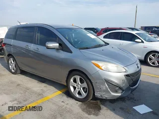 2014 Mazda 5 Sport z VIN JM1CW2BL9E0165101, wystawiony jako IAAI lot #42280068 z przebiegiem 147 336 mil mil oraz . Historia ofert i sprzedaży dostępna na DreamBid. Obrazek 1.