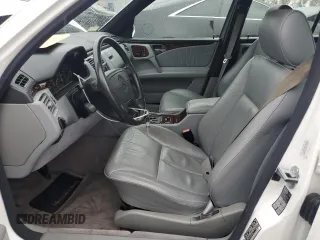 1997 Mercedes-Benz E-Class with VIN WDBJF72F2VA099305, listed as a Copart auction lot 48007935 with 96,410 mi miles and Salvage Title. Bid and sale history available at carsss.com. Image 7.