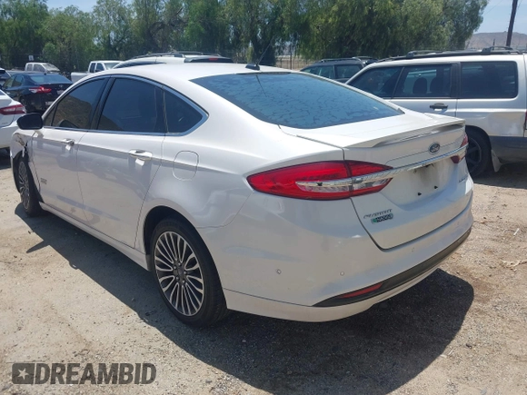 2017 Ford Fusion Titanium z VIN 3FA6P0SU0HR329224, wystawiony jako IAAI lot #42291605 z przebiegiem 176 728 mil mil oraz . Historia ofert i sprzedaży dostępna na DreamBid. Obrazek 3.