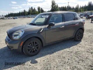 2011 MINI Countryman S with VIN WMWZC3C5XBWH97560, listed as a Copart auction lot 60935855 with 150,354 mi miles and Salvage title. Bid and sale history available at DreamBid. Image 1.
