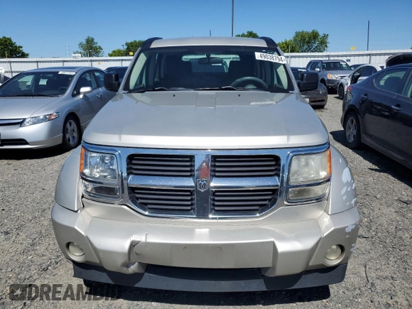 2009 Dodge Nitro SE z VIN 1D8GT28K19W541402, wystawiony jako Copart lot #57487874 z przebiegiem 189 653 mil mil oraz Szkoda całkowita • Salvage title. Historia ofert i sprzedaży dostępna na DreamBid. Obrazek 5.