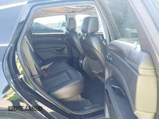 2014 Cadillac SRX Performance Collection z VIN 3GYFNCE35ES517868, wystawiony jako IAAI lot #41775522 z przebiegiem 166 960 mil mil oraz . Historia ofert i sprzedaży dostępna na DreamBid. Obrazek 8.