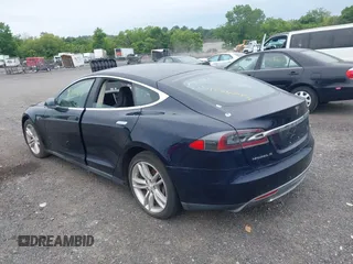 2014 Tesla Model S 60 with VIN 5YJSA1H19EFP32063, listed as a IAAI auction lot 42360872 with 103,495 mi miles and . Bid and sale history available at DreamBid. Image 3.