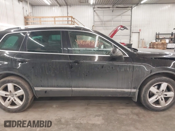 2012 Volkswagen Touareg Sport with VIN WVGEF9BP8CD009511, listed as a IAAI auction lot 41457989 with 87,325 mi miles and . Bid and sale history available at DreamBid. Image 14.