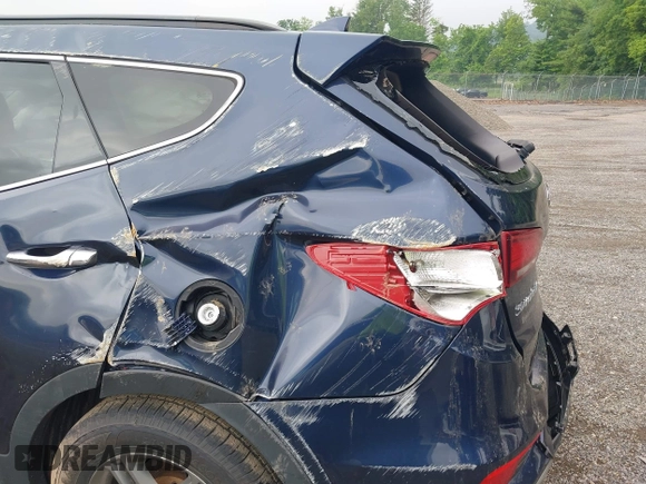 2017 Hyundai Santa Fe 2.4L z VIN 5XYZUDLB9HG421284, wystawiony jako IAAI lot #42441436 z przebiegiem 96 155 mil mil oraz . Historia ofert i sprzedaży dostępna na DreamBid. Obrazek 13.