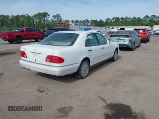 1998 Mercedes-Benz E-Class with VIN WDBJF65FXWA615255, listed as a IAAI auction lot 42146962 with 219,710 mi miles. Bid and sale history available at carsss.com. Image 4.