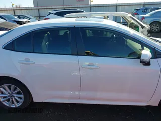 2023 Toyota Corolla Hybrid LE with VIN JTDBCMFE1PJ011085, listed as a IAAI auction lot 41340297 with 34,437 mi miles. Bid and sale history available at carsss.com. Image 14.
