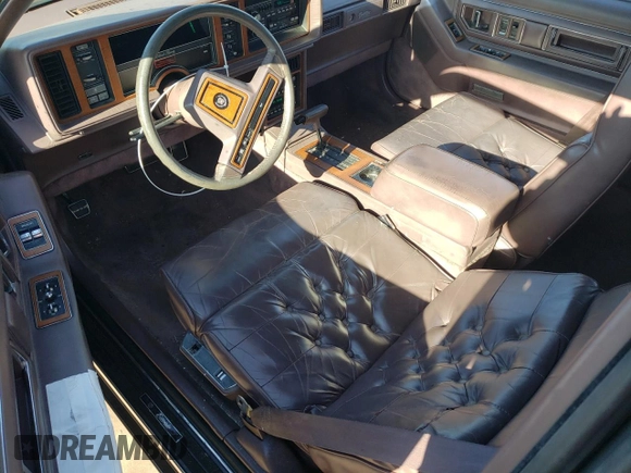1988 Cadillac Eldorado with VIN 1G6EL1153JU632470, listed as a Copart auction lot 78507684 with 176,894 mi miles and Salvage Title. Bid and sale history available at DreamBid. Image 8.