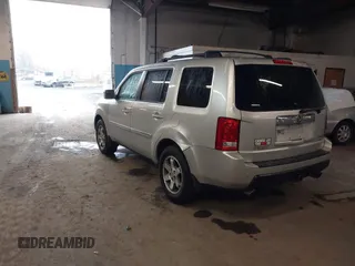 2009 Honda Pilot Touring with VIN 5FNYF48929B010331, listed as a IAAI auction lot 41965094 with 142,490 mi miles and . Bid and sale history available at carsss.com. Image 3.