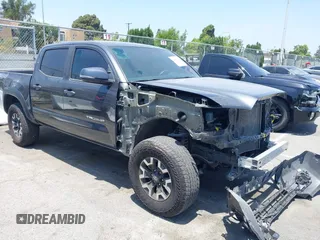 2023 Toyota Tacoma SR with VIN 3TMCZ5AN1PM601516, listed as a IAAI auction lot 42505346 with 38,532 mi miles and . Bid and sale history available at DreamBid. Image 1.