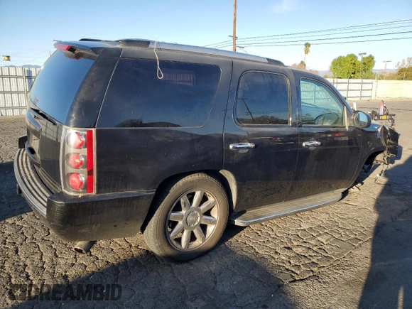 2013 GMC Yukon Denali with VIN 1GKS1EEF0DR205906, listed as a Copart auction lot 87969385 with 128,283 mi miles and Salvage Title. Bid and sale history available at carsss.com. Image 3.