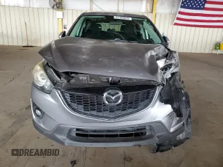 2014 Mazda CX-5 Touring z VIN JM3KE2CY7E0349484, wystawiony jako Copart lot #51188665 z przebiegiem 175 131 mil mil oraz Szkoda całkowita • Salvage title. Historia ofert i sprzedaży dostępna na DreamBid. Obrazek 5.