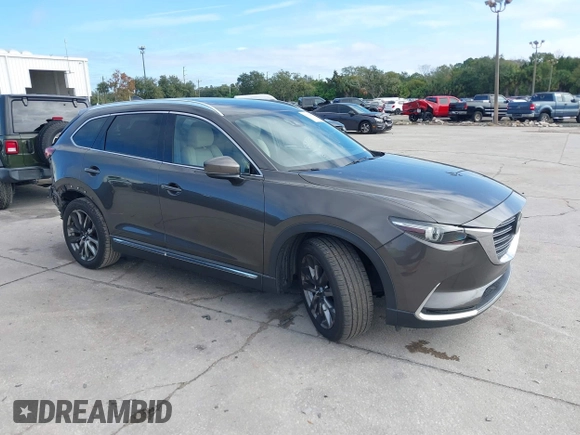 2017 Mazda CX-9 Grand Touring with VIN JM3TCADY7H0133092, listed as a IAAI auction lot 41133652 with 233,454 mi miles and . Bid and sale history available at DreamBid. Image 1.