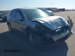 2014 Mazda CX-5 Touring z VIN JM3KE4CY7E0427399, wystawiony jako IAAI lot #42323096 z przebiegiem Nie podano mil oraz . Historia ofert i sprzedaży dostępna na DreamBid. Obrazek 1.