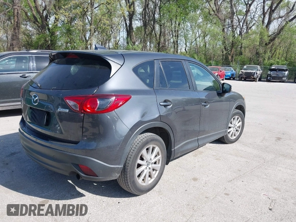 2016 Mazda CX-5 Touring z VIN JM3KE2CY4G0708972, wystawiony jako IAAI lot #42043013 z przebiegiem 157 573 mil mil oraz . Historia ofert i sprzedaży dostępna na DreamBid. Obrazek 4.