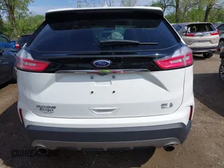 2020 Ford Edge SEL z VIN 2FMPK4J9XLBA07663, wystawiony jako IAAI lot #42115904 z przebiegiem 45 385 mil mil oraz . Historia ofert i sprzedaży dostępna na DreamBid. Obrazek 17.