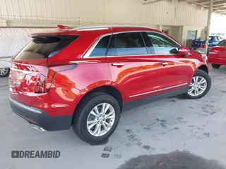 2024 Cadillac XT5 FWD Luxury with VIN 1GYKNAR42RZ738679, listed as a IAAI auction lot 42355530 with 14,660 mi miles and . Bid and sale history available at DreamBid. Image 4.