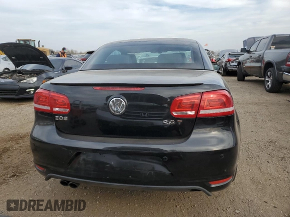 2015 Volkswagen Eos Komfort with VIN WVWBW8AH4FV001321, listed as a Copart auction lot 78718404 with 73,296 mi miles and Salvage Title. Bid and sale history available at DreamBid. Image 6.