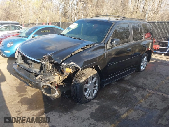 2006 GMC Envoy Denali with VIN 1GKET63M962355586, listed as a IAAI auction lot 41881023 with 235,506 mi miles. Bid and sale history available at carsss.com. Image 2.