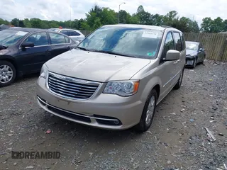 2014 Chrysler Town & Country Touring with VIN 2C4RC1BG2ER413257, listed as a IAAI auction lot 42181370 with 163,374 mi miles and . Bid and sale history available at DreamBid. Image 2.