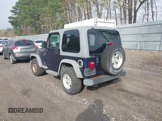 2005 Jeep Wrangler Sport with VIN 1J4FA49S25P302627, listed as a IAAI auction lot 42100601 with 169,650 mi miles. Bid and sale history available at carsss.com. Image 3.