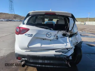 2016 Mazda CX-5 Grand Touring with VIN JM3KE4DY8G0671256, listed as a Copart auction lot 52920975 with 87,822 mi miles and Non Repairable. Bid and sale history available at carsss.com. Image 6.