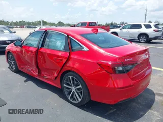 2023 Honda Civic Touring with VIN 2HGFE1F94PH323451, listed as a IAAI auction lot 42383422 with 6,120 mi miles and . Bid and sale history available at DreamBid. Image 3.