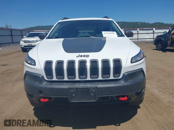 2014 Jeep Cherokee Trailhawk with VIN 1C4PJMBSXEW236807, listed as a IAAI auction lot 42660980 with 157,225 mi miles and . Bid and sale history available at DreamBid. Image 13.