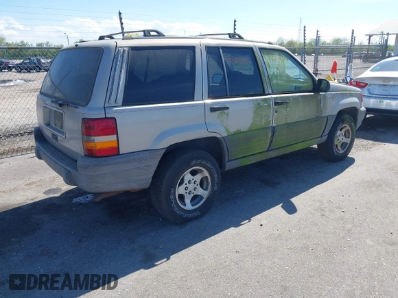 1996 Jeep Grand Cherokee Laredo with VIN 1J4FX58S2TC397006, listed as a IAAI auction lot 41836108 with 136,742 mi miles. Bid and sale history available at carsss.com. Image 4.