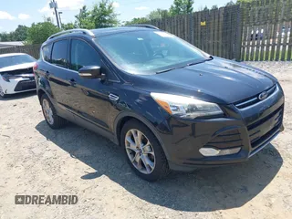2015 Ford Escape Titanium z VIN 1FMCU0JX8FUC60804, wystawiony jako IAAI lot #42567139 z przebiegiem 100 207 mil mil oraz . Historia ofert i sprzedaży dostępna na DreamBid. Obrazek 1.
