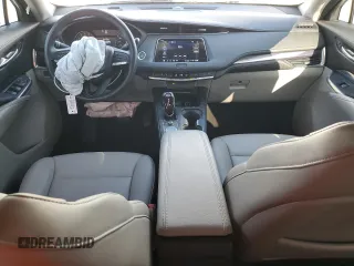 2023 Cadillac XT4 FWD Luxury with VIN 1GYAZAR42PF219114, listed as a Copart auction lot 61830125 with 23,508 mi miles and Salvage title. Bid and sale history available at DreamBid. Image 8.