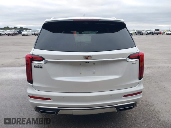 2021 Cadillac XT6 Premium Luxury z VIN 1GYKPCRS8MZ233209, wystawiony jako IAAI lot #40012714 z przebiegiem 45 599 mil mil oraz . Historia ofert i sprzedaży dostępna na DreamBid. Obrazek 16.