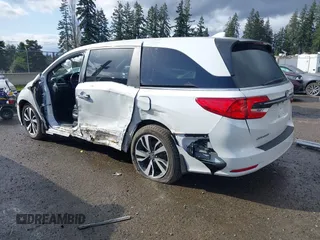 2021 Honda Odyssey Touring with VIN 5FNRL6H87MB015310, listed as a IAAI auction lot 41916339 with 58,808 mi miles. Bid and sale history available at carsss.com. Image 3.