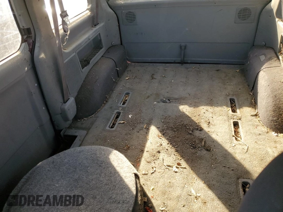 1994 Ford Aerostar z VIN 1FMCA11U3RZA85857, wystawiony jako Copart lot #79948454 z przebiegiem 211 748 mil mil oraz Tytuł czysty. Historia ofert i sprzedaży dostępna na DreamBid. Obrazek 11.