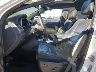 2018 Jeep Grand Cherokee High Altitude with VIN 1C4RJECG1JC125602, listed as a Copart auction lot 88702275 with 59,701 mi miles and Salvage title. Bid and sale history available at DreamBid. Image 7.